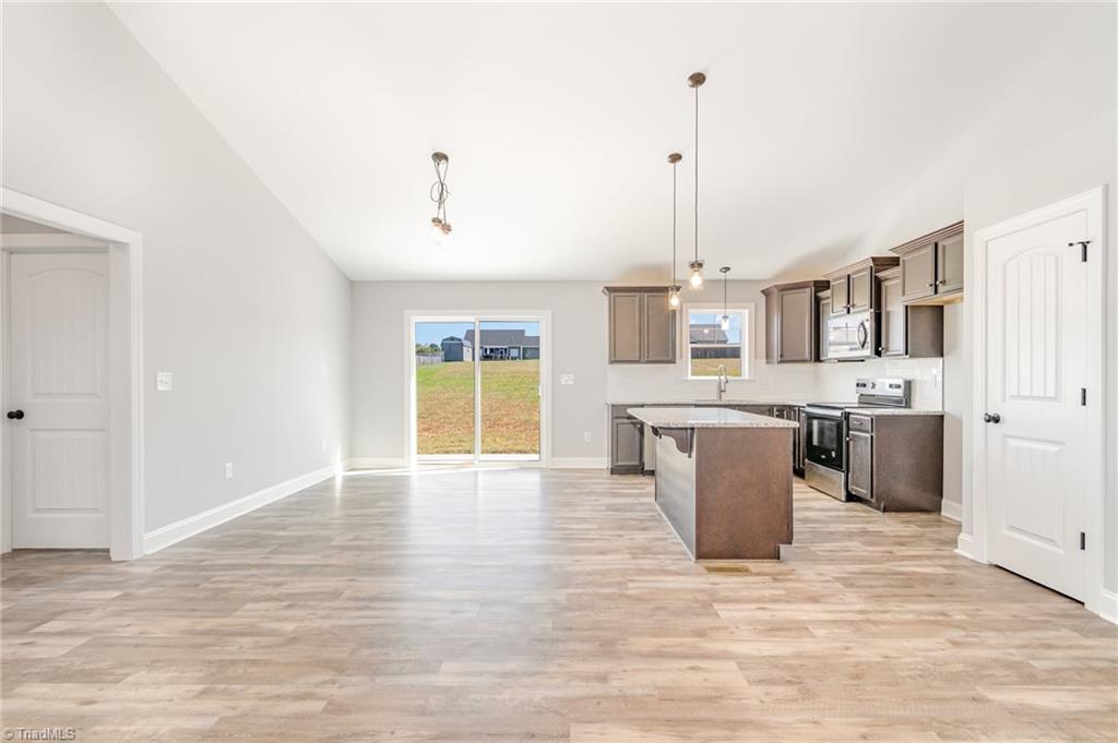 139 Knight Farm Road Stokesdale, NC 27357 - Photo 7 of 26 Dining Area and Kitchen