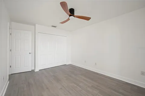 a view of a room with wooden floor