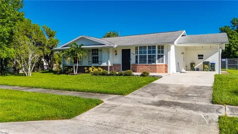 a view of house with garden and patio