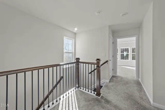 a view of a hallway with windows