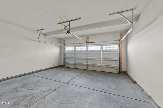a view of a livingroom with an empty space and a window