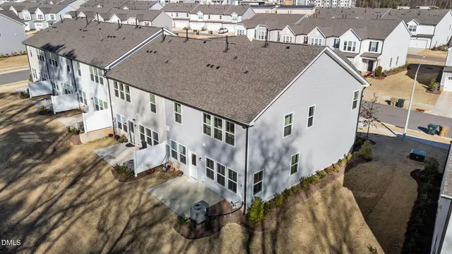 view of a house with yard and sitting area