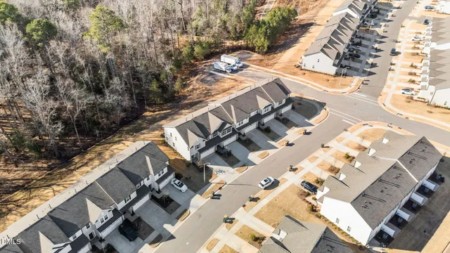 a view of a house with backyard porch and sitting area