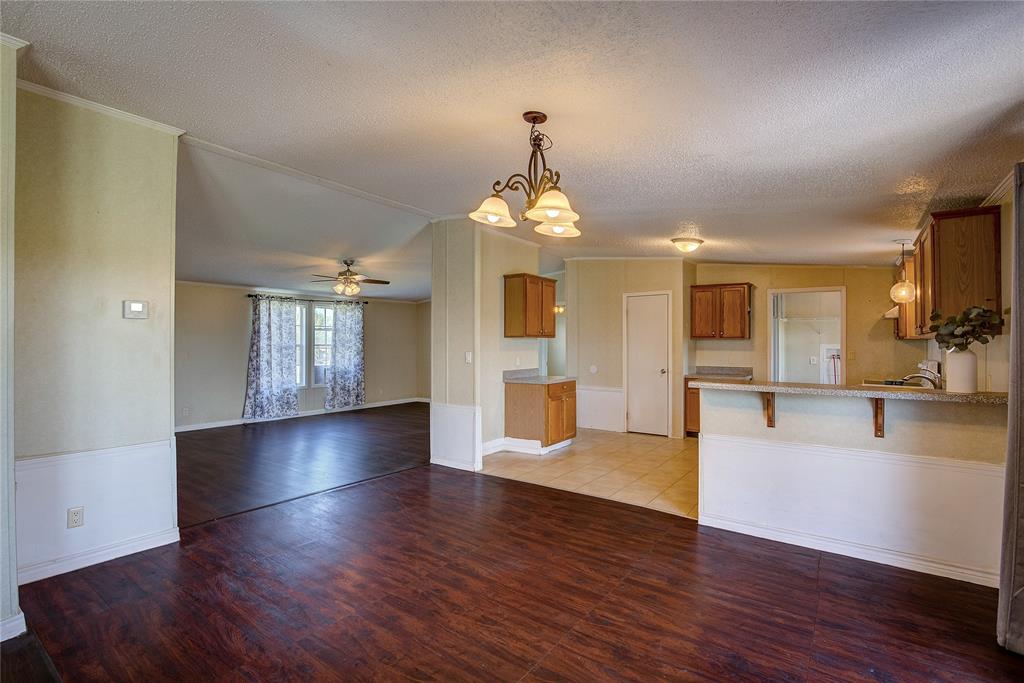 3077 Pecan Court Princeton, TX 75407 - Photo 13 of 37 a view of a kitchen with furniture and wooden floor
