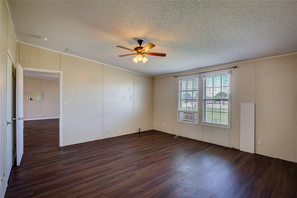3077 Pecan Court Princeton, TX 75407 - Photo 20 of 37 wooden floor in an empty room with a window