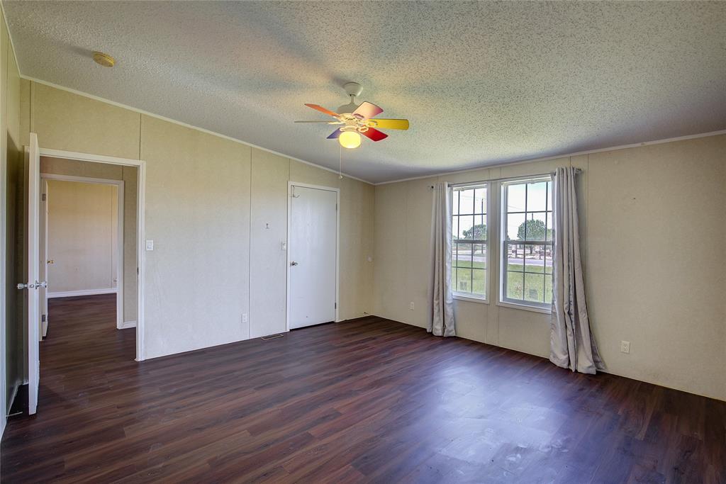 3077 Pecan Court Princeton, TX 75407 - Photo 25 of 37 wooden floor in an empty room with a window