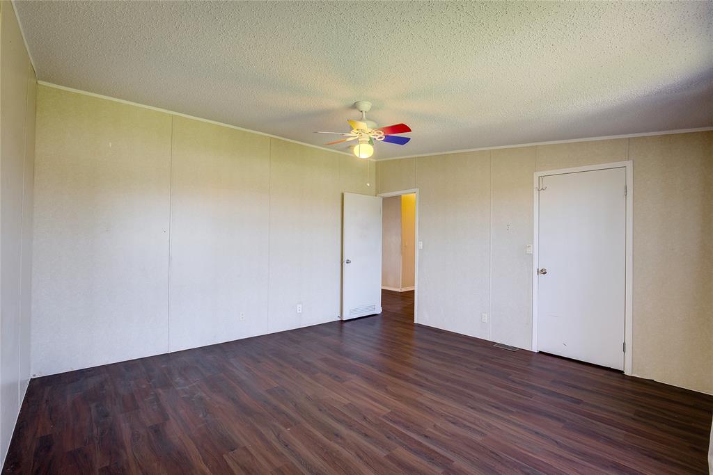 3077 Pecan Court Princeton, TX 75407 - Photo 26 of 37 a view of an empty room and wooden floor