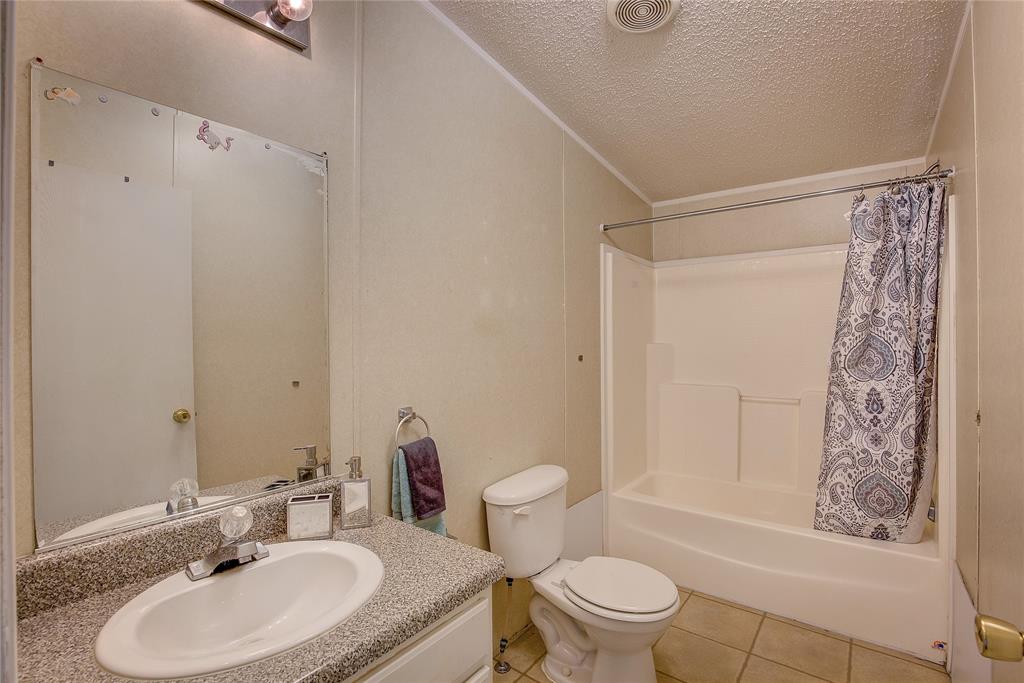3077 Pecan Court Princeton, TX 75407 - Photo 29 of 37 a bathroom with a sink toilet and shower