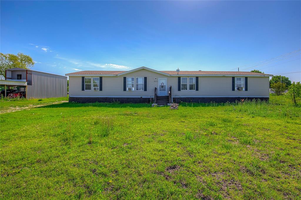 3077 Pecan Court Princeton, TX 75407 - Photo 3 of 37 a house view with a garden space