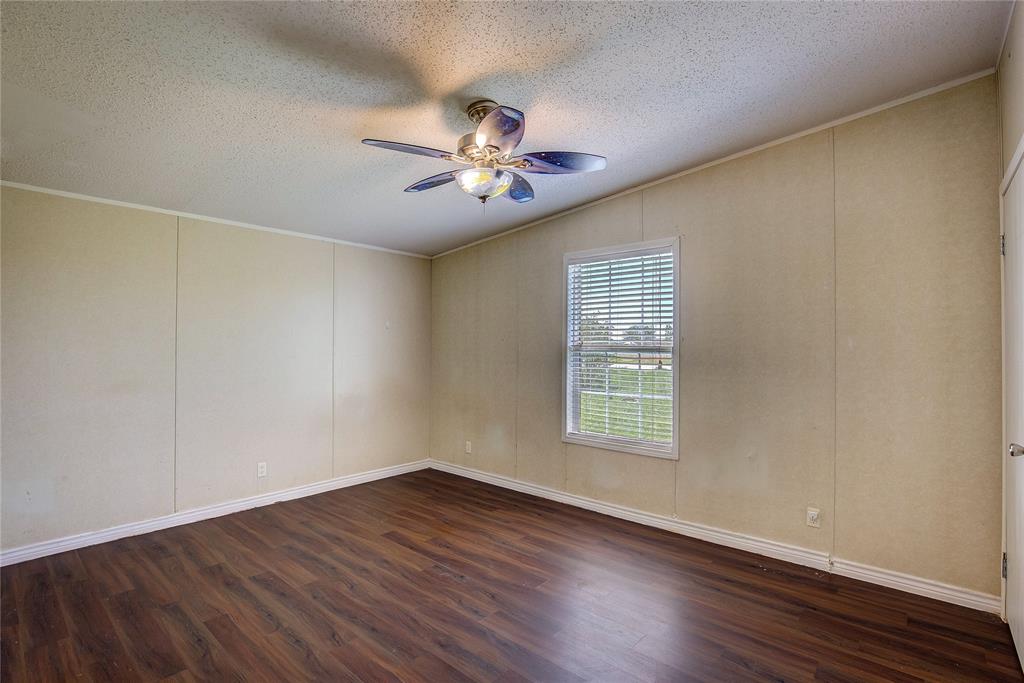 3077 Pecan Court Princeton, TX 75407 - Photo 31 of 37 a view of an empty room with wooden floor and a window