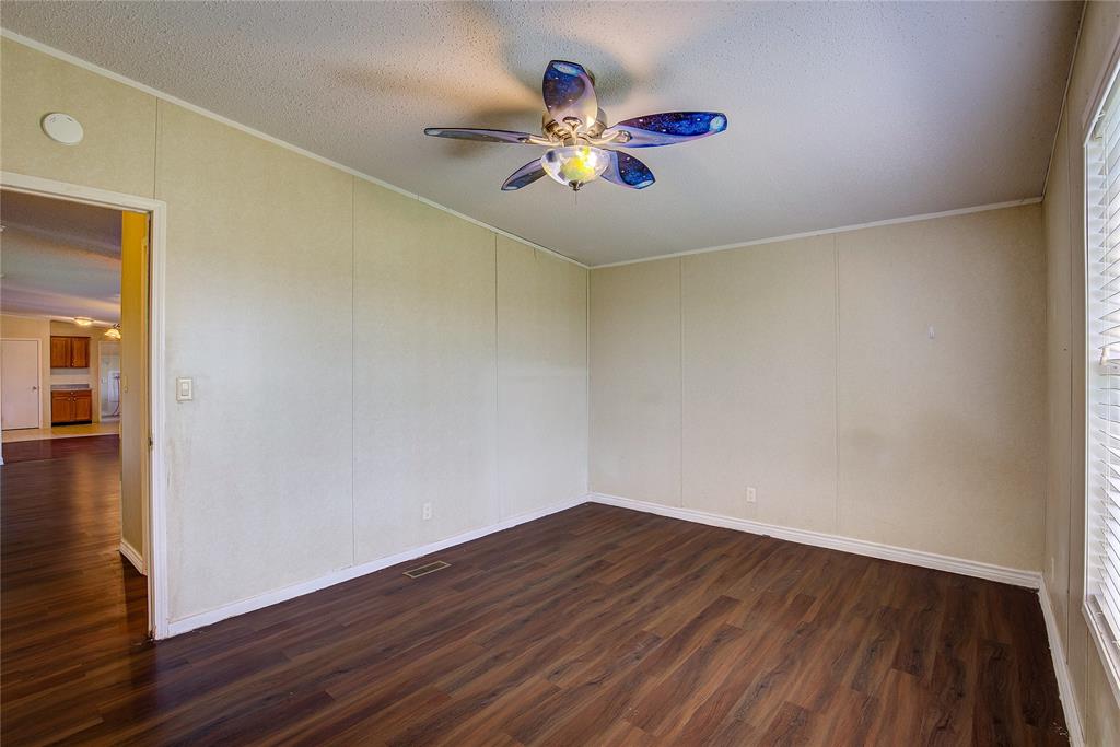 3077 Pecan Court Princeton, TX 75407 - Photo 32 of 37 a view of an empty room with wooden floor