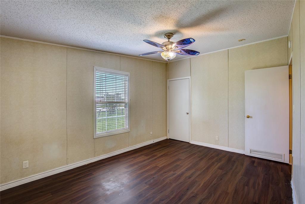 3077 Pecan Court Princeton, TX 75407 - Photo 33 of 37 wooden floor in an empty room with a window