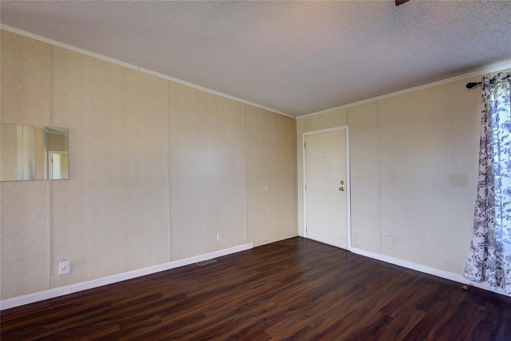 3077 Pecan Court Princeton, TX 75407 - Photo 7 of 37 a view of an empty room with wooden floor