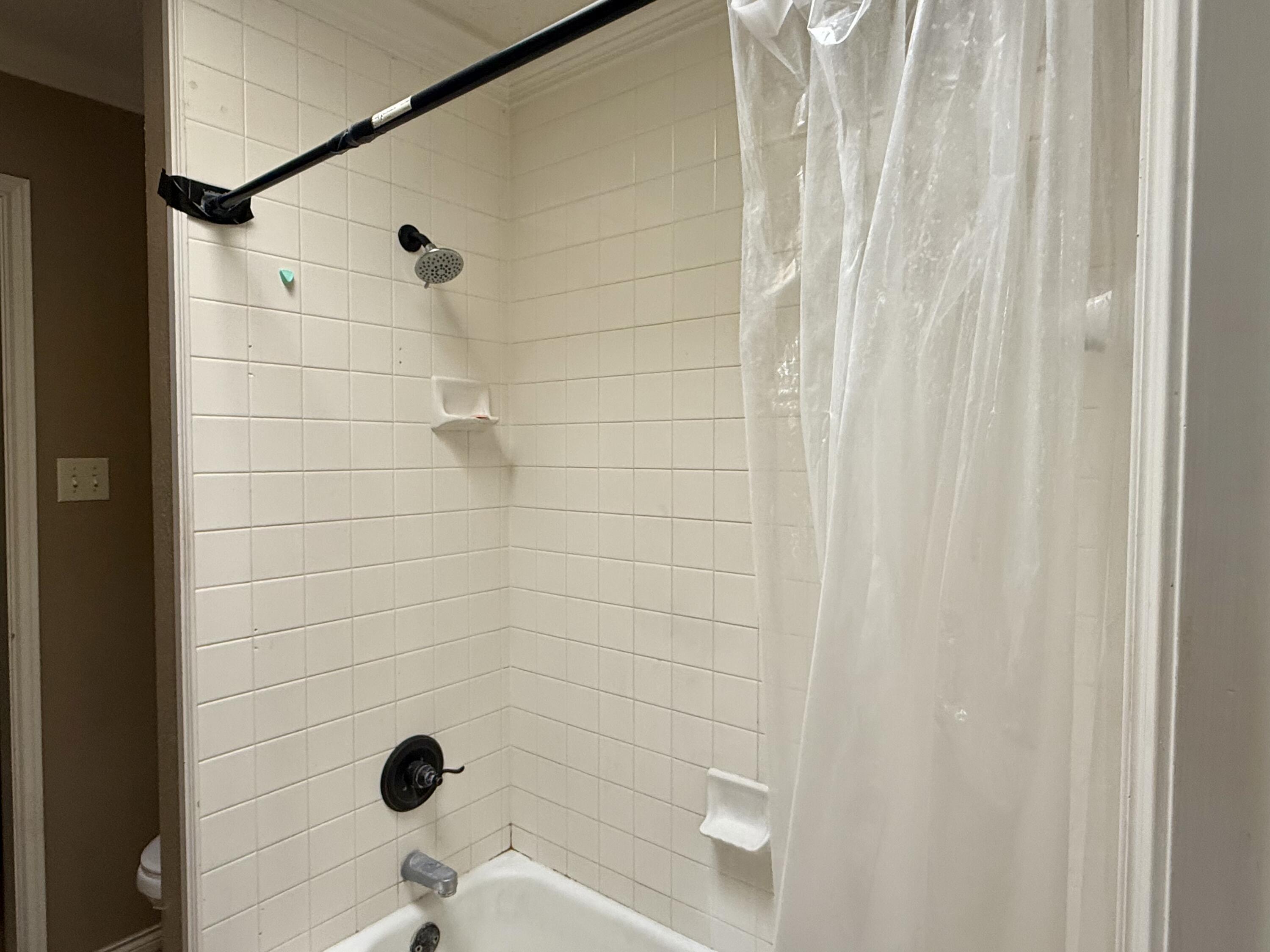 5912 74th Street Lubbock, TX 79424 - Photo 11 of 12 a bathroom with a shower