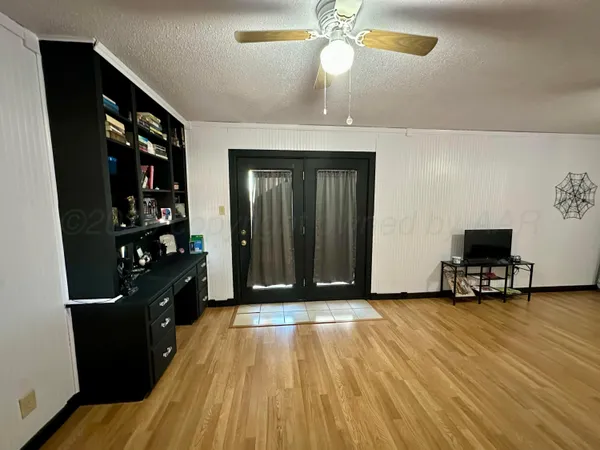 a view of a livingroom with furniture and wooden floor