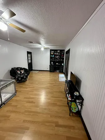 a view of room with furniture and a flat screen tv