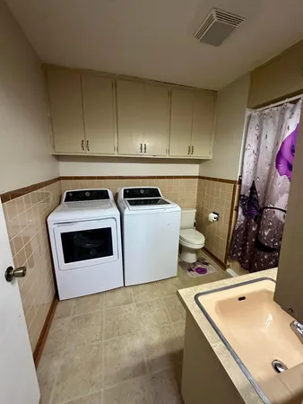 a utility room with dryer and washer
