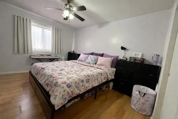 a bedroom with bed and window