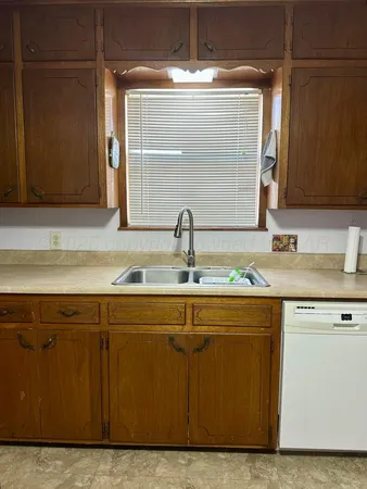 a close view of sink and cabinets