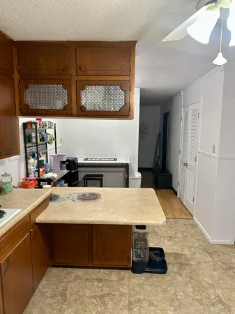 a room with a bed and a table with wooden floor