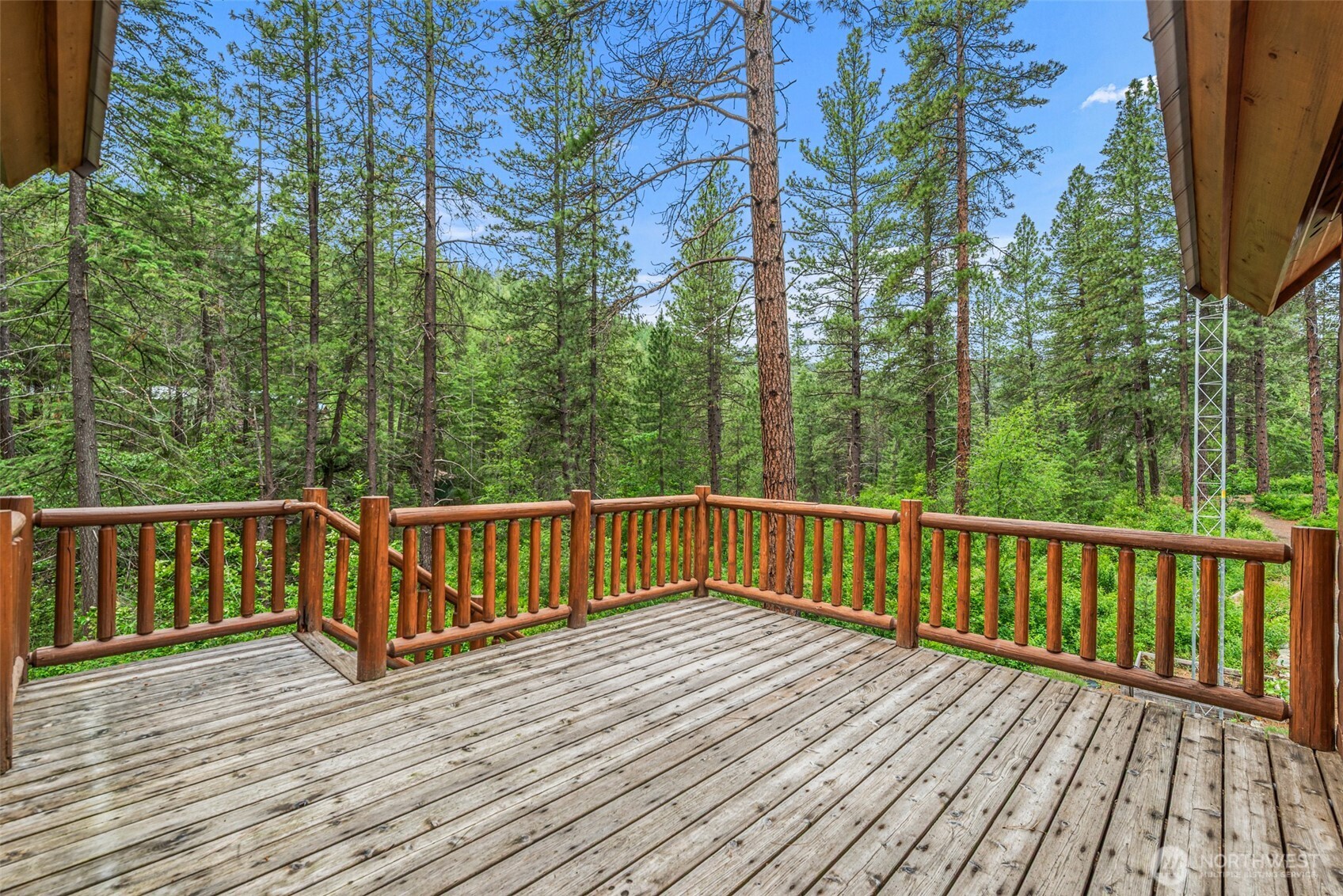 3888 Camas Creek Road Peshastin, WA 98847 - Photo 11 of 40 a view of deck with trees with wooden floor and fence