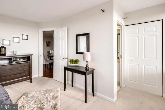 a bedroom with a bed and a desk in it