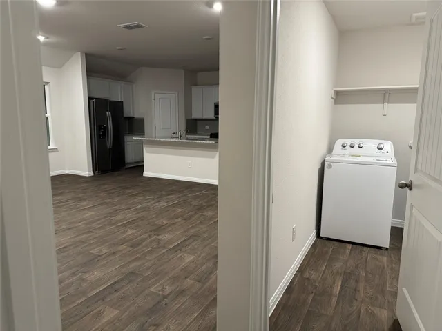 a bathroom with double vanity sink and shower