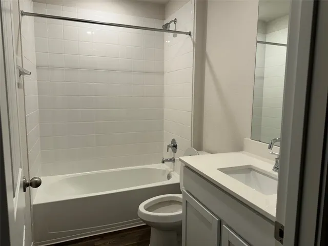 a bathroom with a toilet and a sink