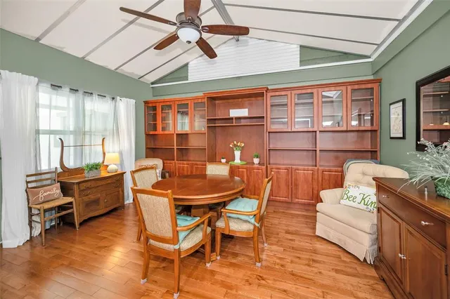 a dining room with furniture and wooden floor