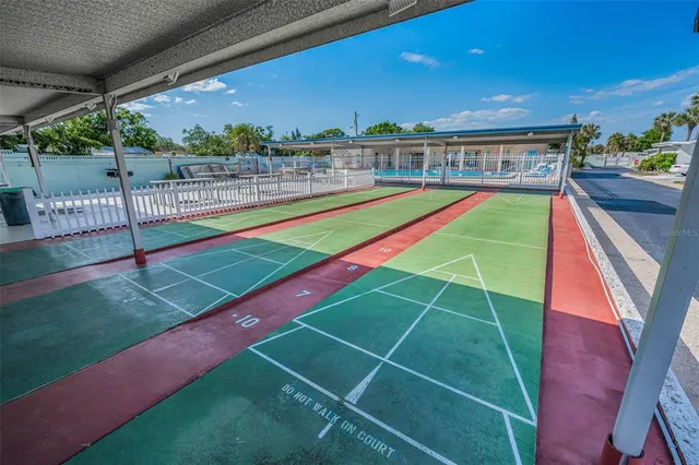 a view of a backyard with a swimming pool