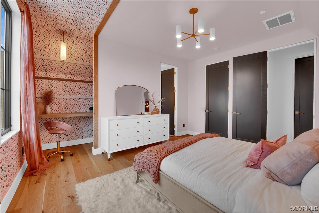 3501 Ormiston Grove Circle Henrico, VA 23233 - Photo 13 of 48 a bedroom with a bed and a chandelier