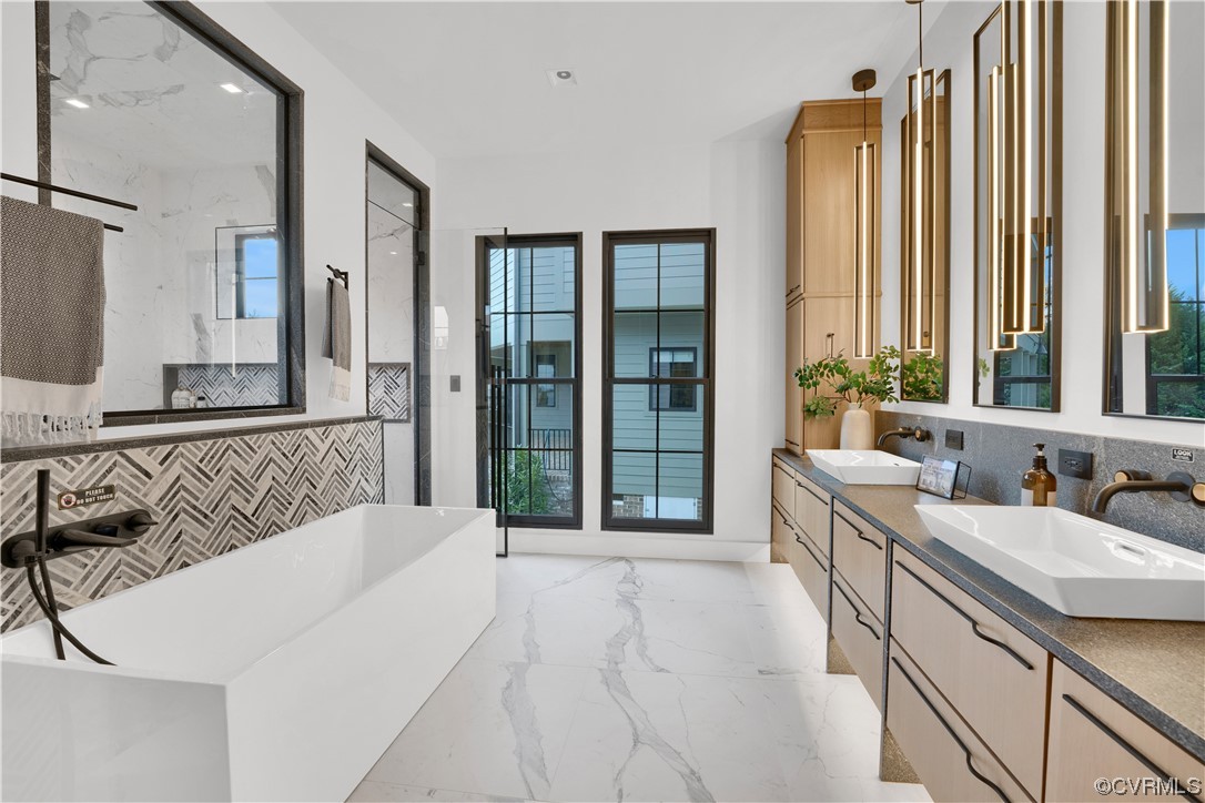 3501 Ormiston Grove Circle Henrico, VA 23233 - Photo 38 of 48 a spacious bathroom with a bathtub and a sink