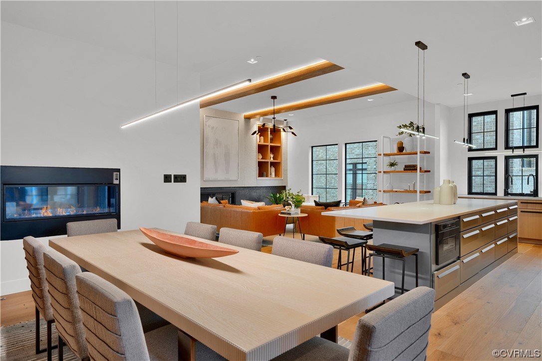 3501 Ormiston Grove Circle Henrico, VA 23233 - Photo 43 of 48 a living room with a table chairs and a kitchen view