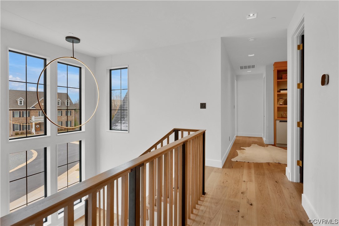 3501 Ormiston Grove Circle Henrico, VA 23233 - Photo 9 of 48 a view of hallway with wooden floor and chandelier