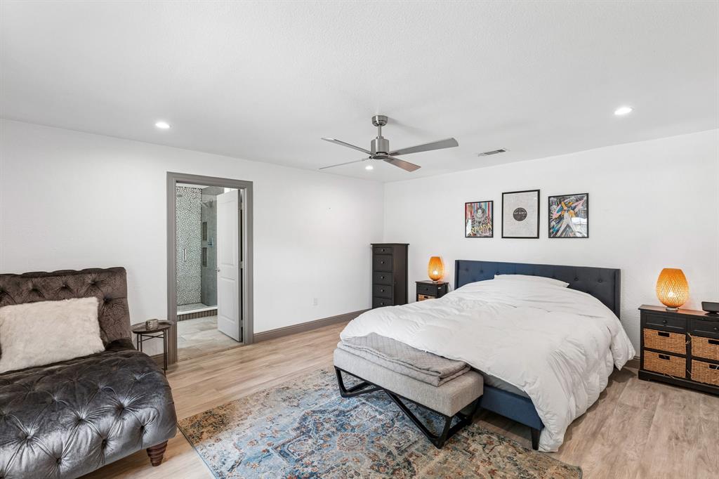 5216 Ashbrook Road Dallas, TX 75227 - Photo 18 of 28 Recessed lighting, wood-finish flooring, ceiling fan, and an en-suite bathroom with a tiled shower