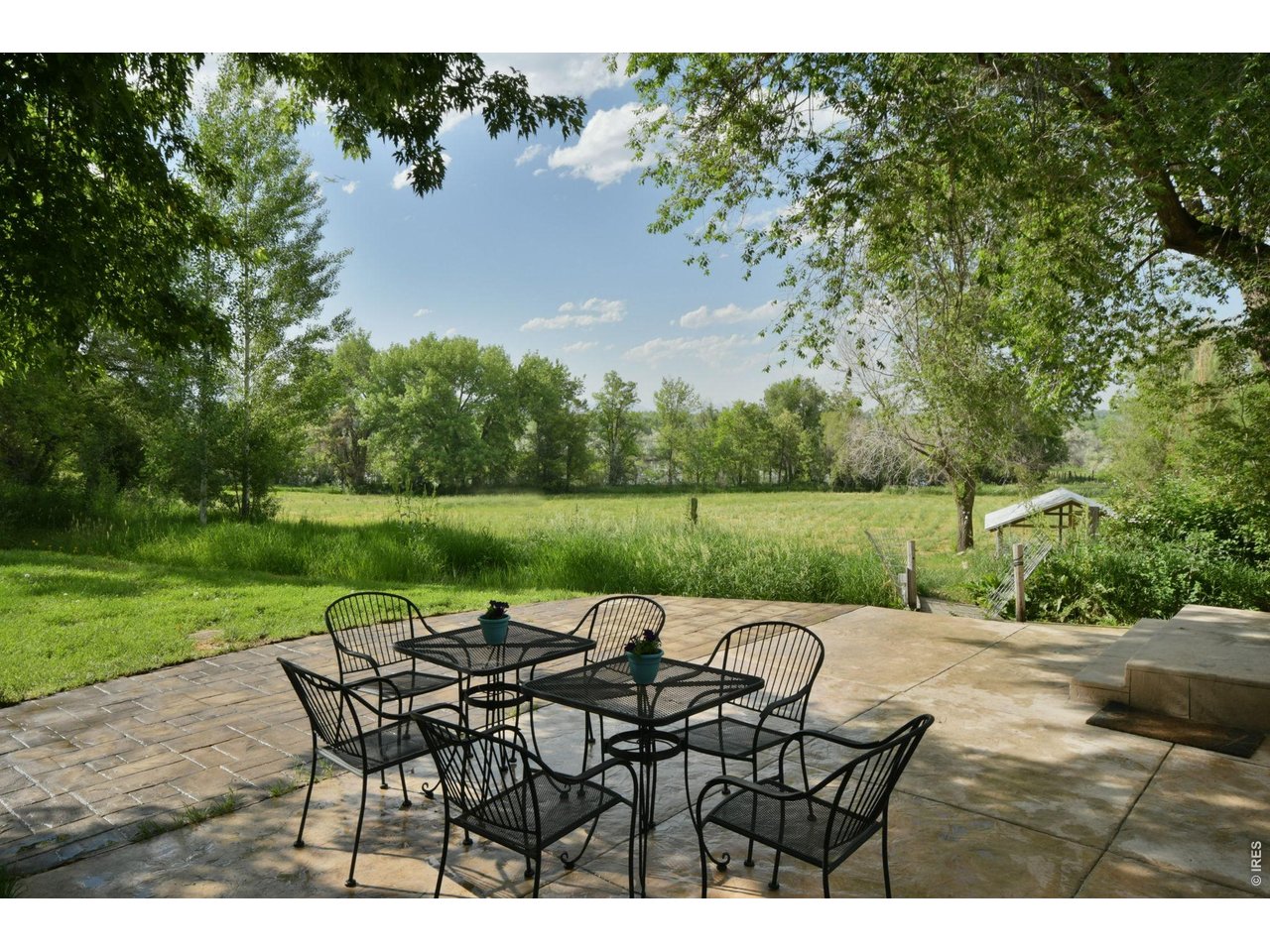 6903 Valmont Road Boulder, CO 80301 - Photo 22 of 47 Step onto the stone patio and you're greeted with a front-row seat to a softly flowing waterway.