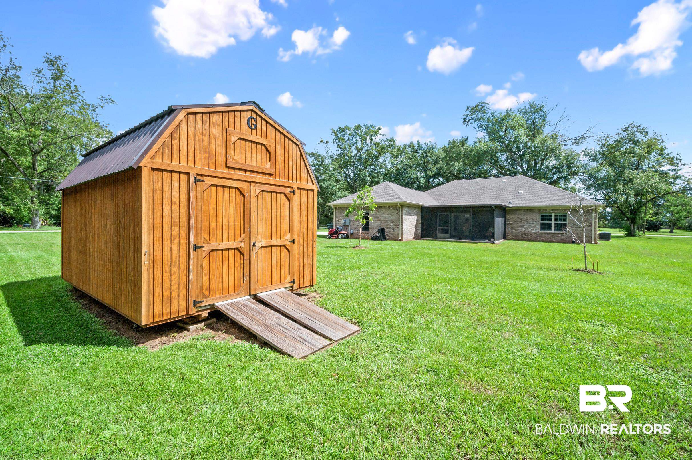 1700 South Juniper Street Foley, AL 36535 - Photo 42 of 51 View of outbuilding with a lawn