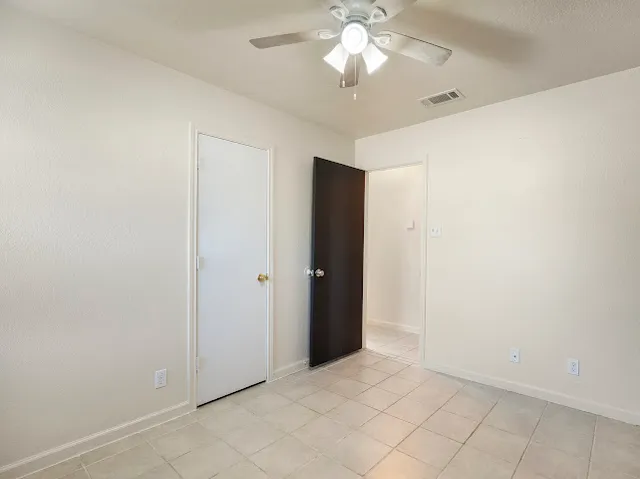 an empty room with a bathroom