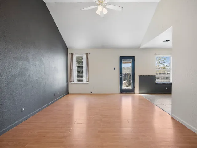 a view of an empty room with a window