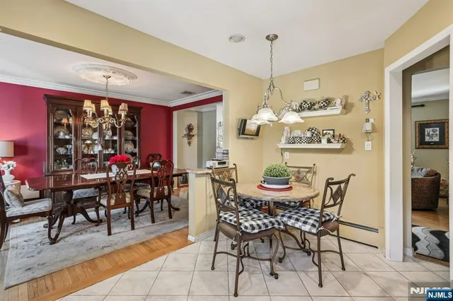 a kitchen with stainless steel appliances granite countertop a stove top oven a refrigerator and cabinets