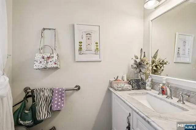 a bedroom with a bed a flat screen tv and a large window with the outer view