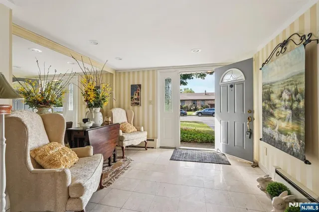 a living room with furniture and a bed