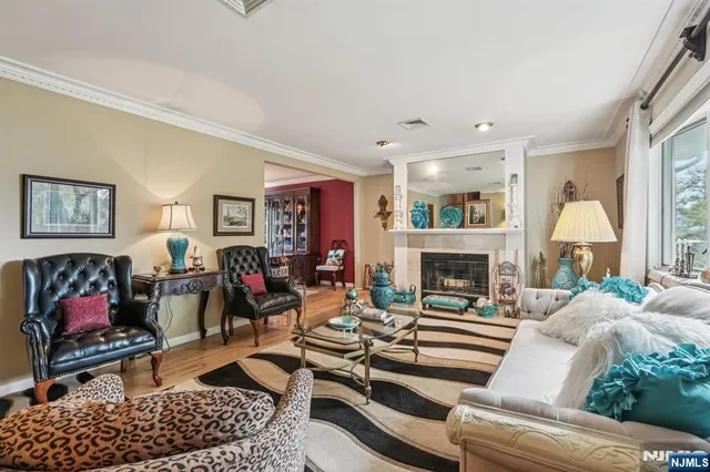 a view of a livingroom with furniture and a fireplace