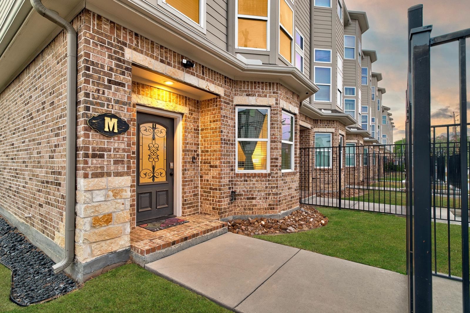 2020 McGowen Street, Unit M Houston, TX 77004 - Photo 1 of 29 Spacious 3 story, 3.5 Baths and 3 Bedroom townhome with a rooftop skydeck. Option to rent FURNISHED!