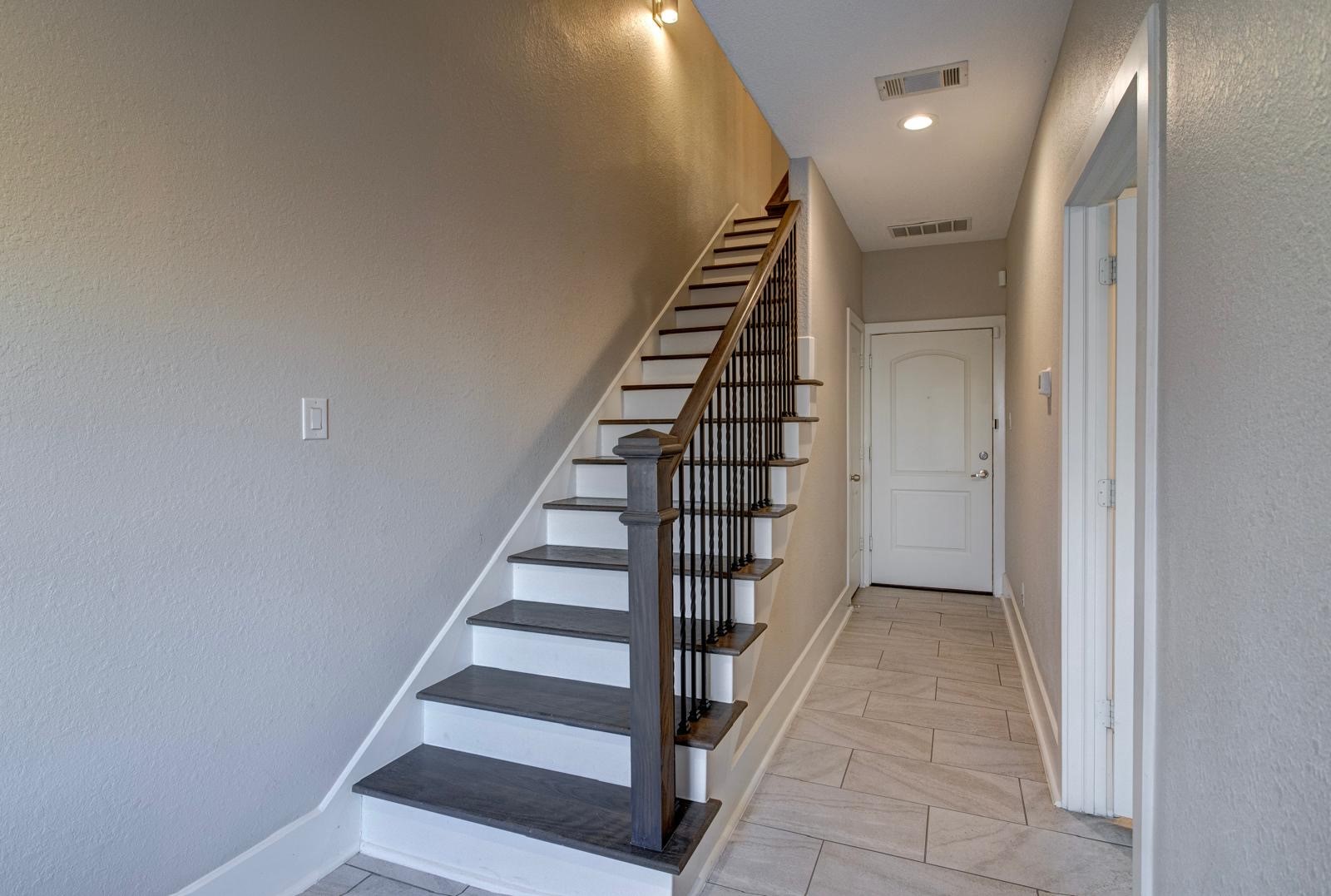 2020 McGowen Street, Unit M Houston, TX 77004 - Photo 3 of 29 Staircase leading to the living room and kitchen
