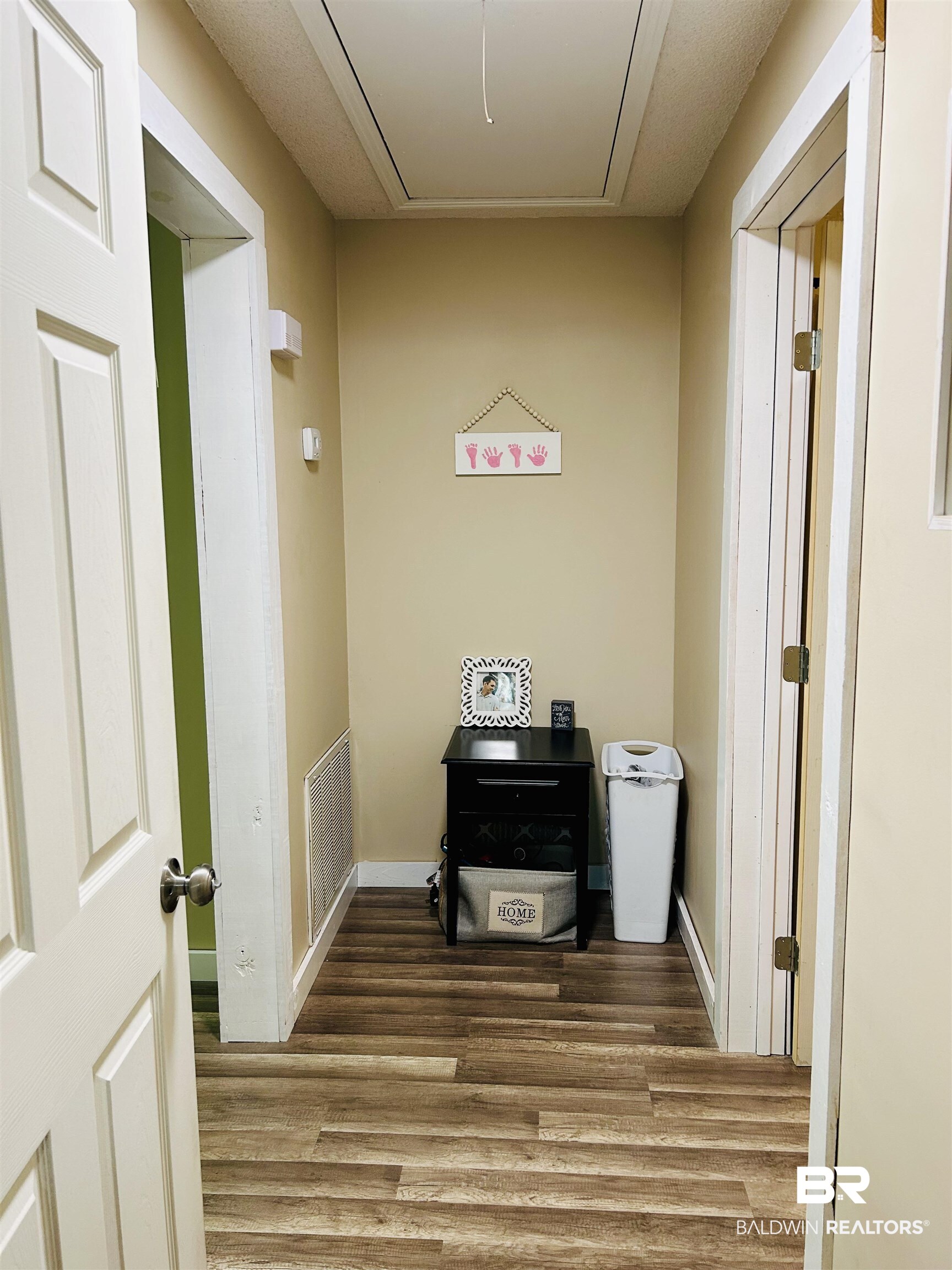3850 Newman Road Mobile, AL 36695 - Photo 11 of 27 Hallway featuring hardwood / wood-style floors