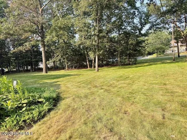 a view of a swimming pool with an outdoor space and seating area