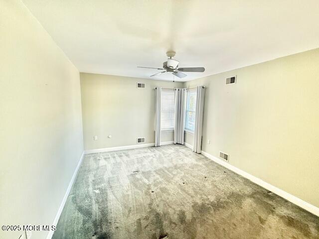 2138 Whitesville Road Toms River, NJ 08755 - Photo 9 of 19 a view of an empty room with a chandelier fan