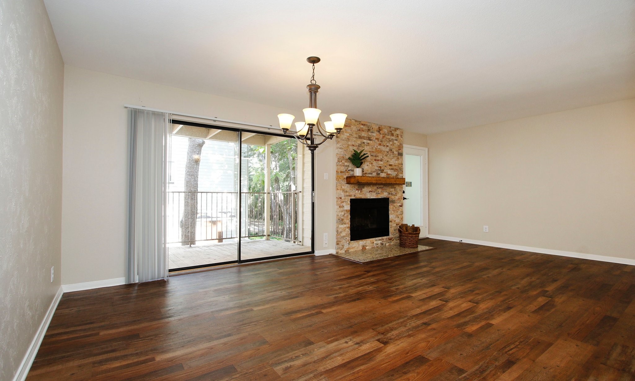 3500 Tangle Brush Drive, Unit 138 Spring, TX 77381 - Photo 9 of 28 a view of an empty room with wooden floor and a window