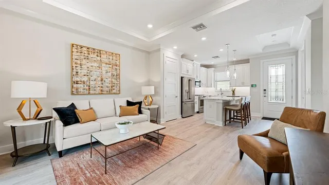 a bedroom with a bed window and mirror